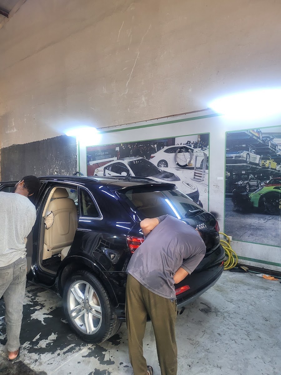 The H&M team working on an Audi